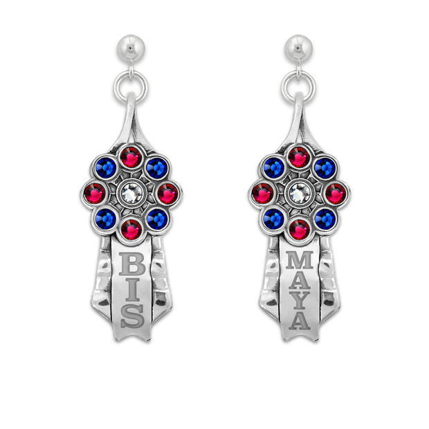 A pair of sterling silver ribbon earrings with a rosette design featuring multicolored crystals (red, blue, and clear) and personalized engravings, dangle post style.