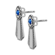Silver rosette post earrings with blue crystals on a white background
